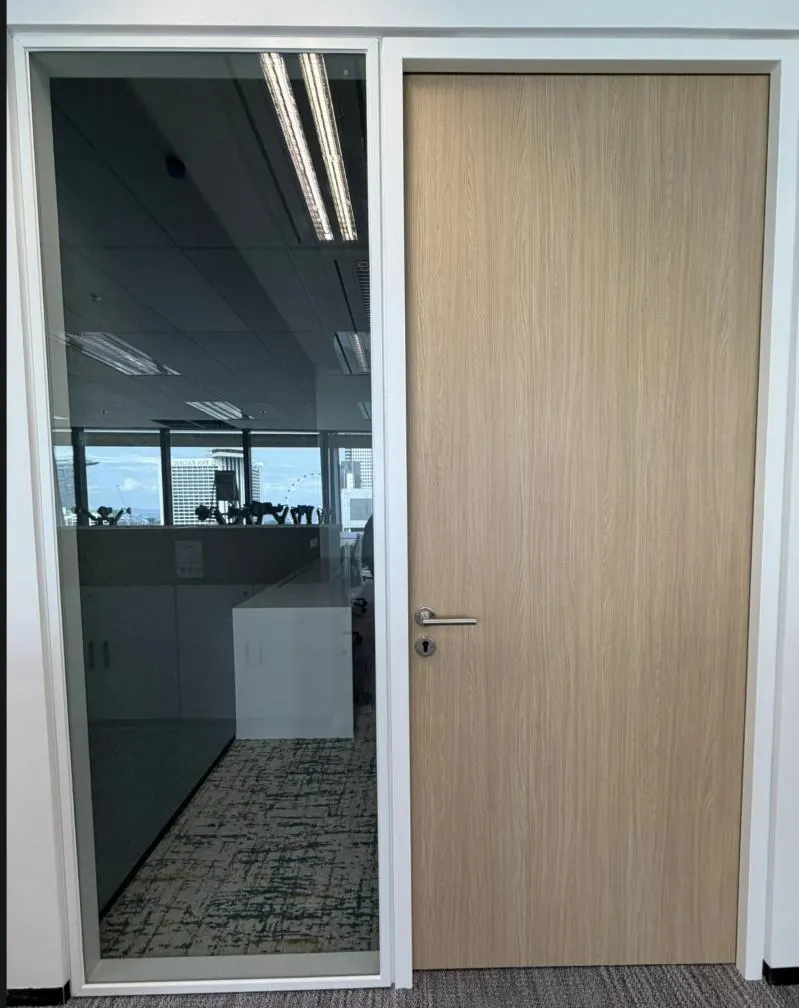 Timber door within a glass partition at Boeing