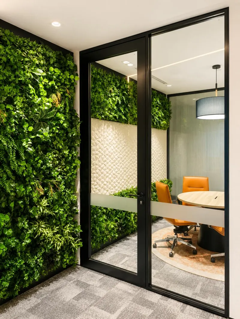 Glazed door set into a green wall at IOI Tower