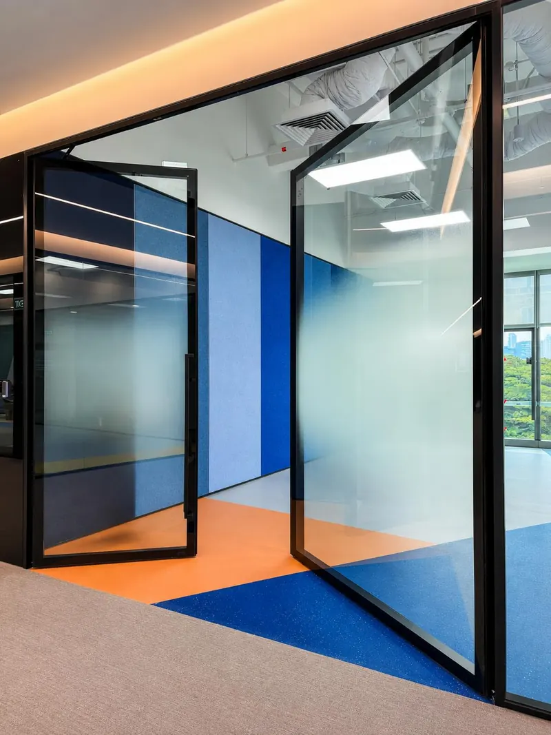 Mapletree: pivoting glass door in a black frame